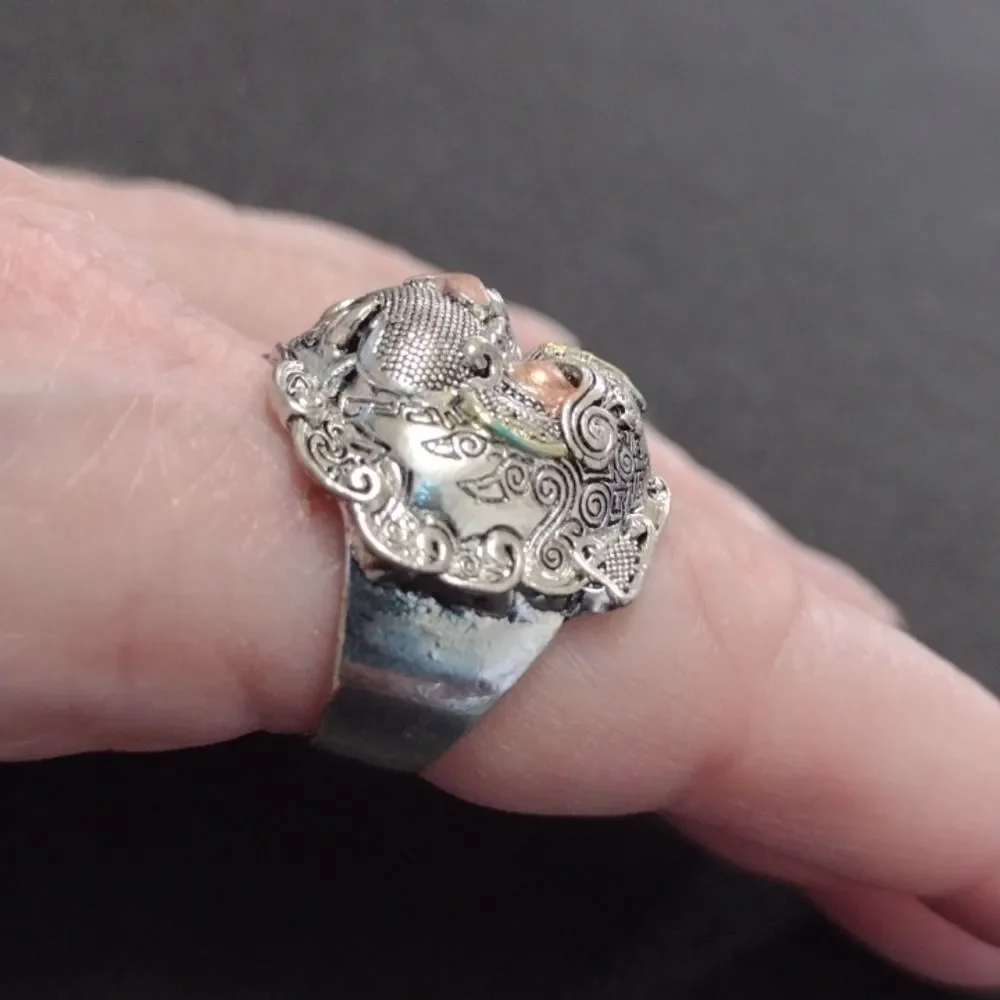 Silver tone ring looks like a tribal animal size 7